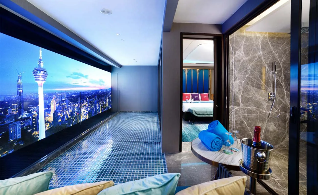 Private pool inside a Royal Lexis KLCC suite overlooking KL Tower at night